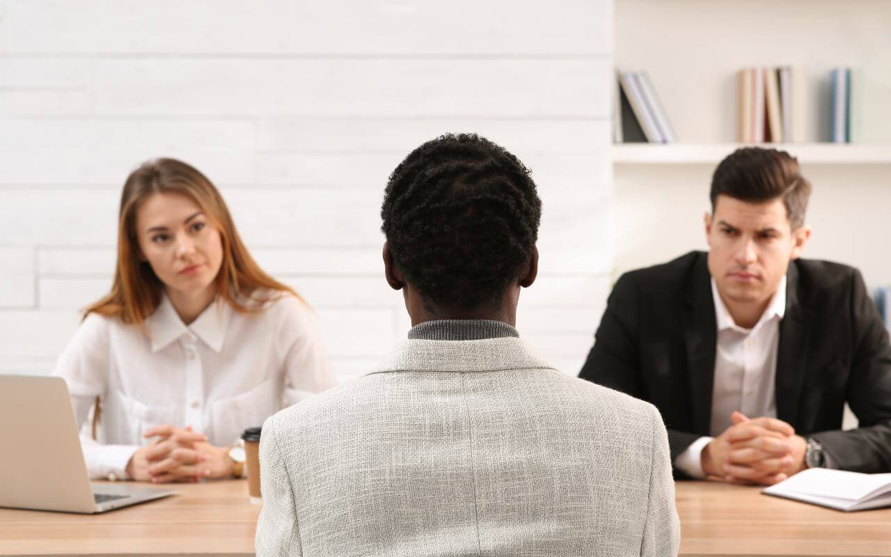 HR discrimination question people across desk