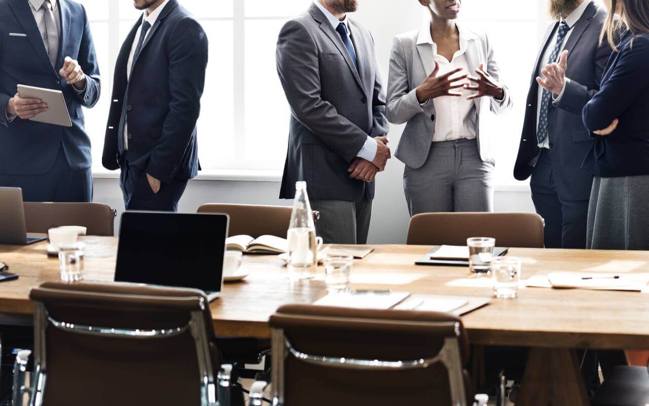 - Professionals talk in boardroom Workplace culture