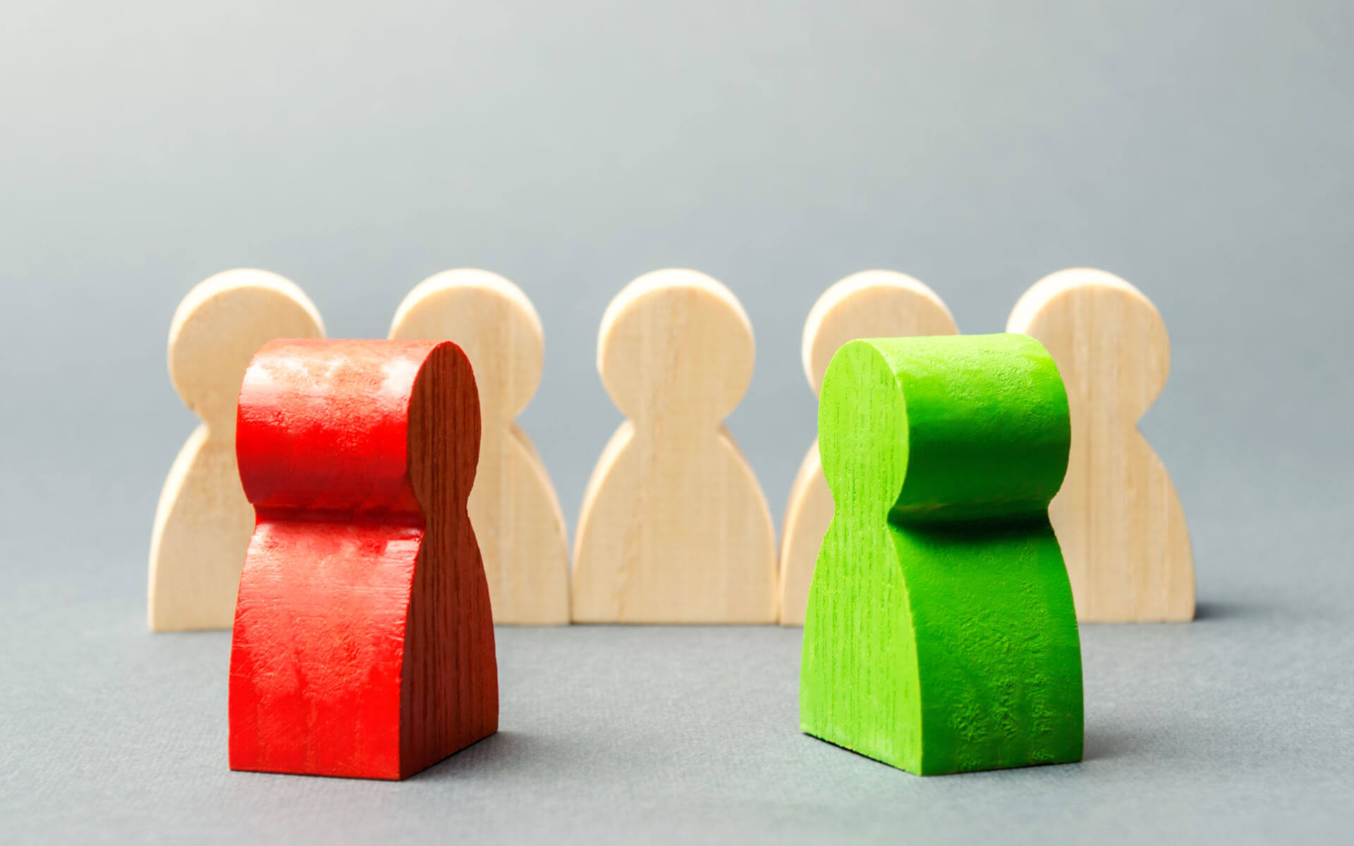 Family Law Debate Red Green Wooden Figures