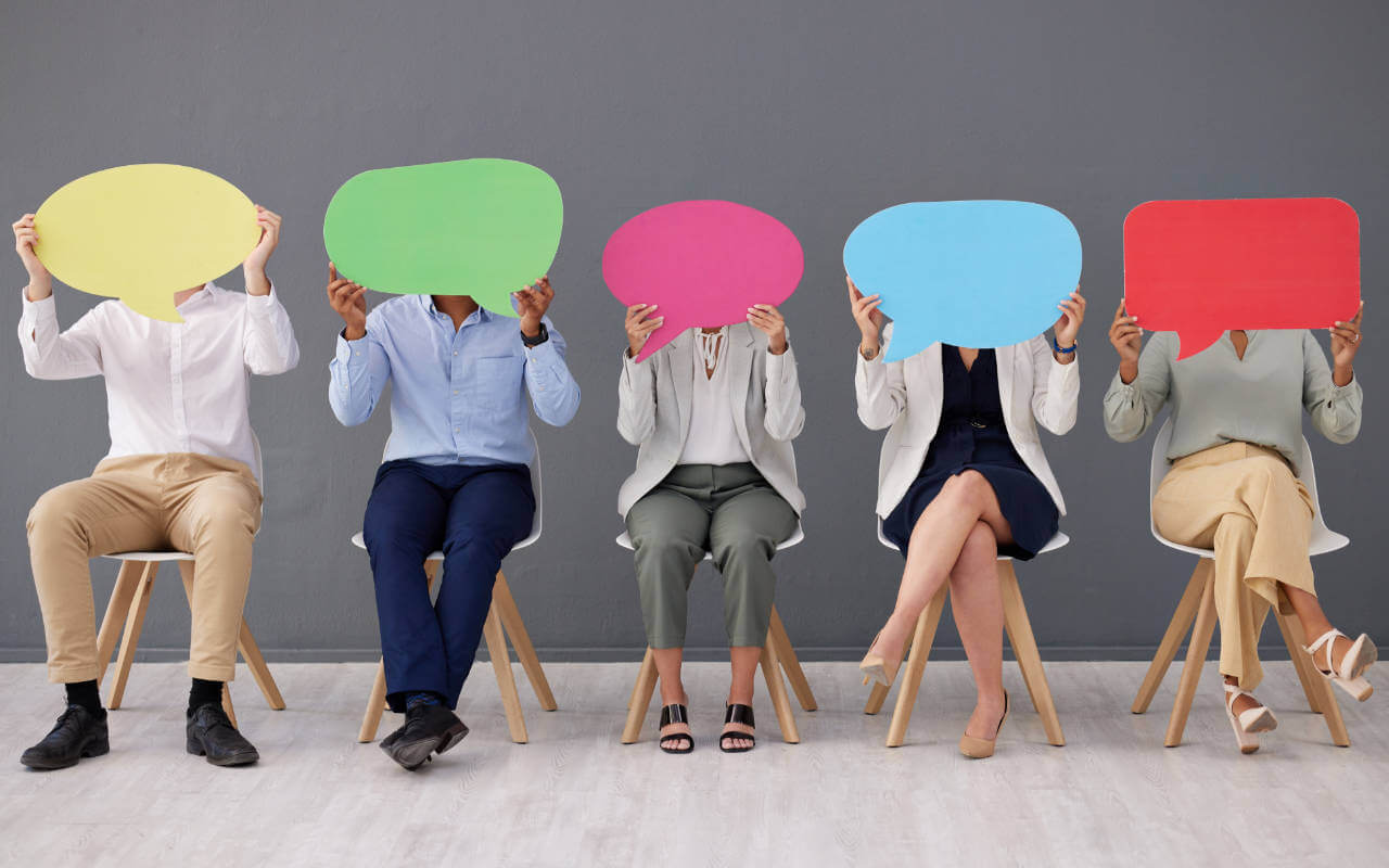 Opinions and beliefs in the workplace Employees hold coloured speech bubbles