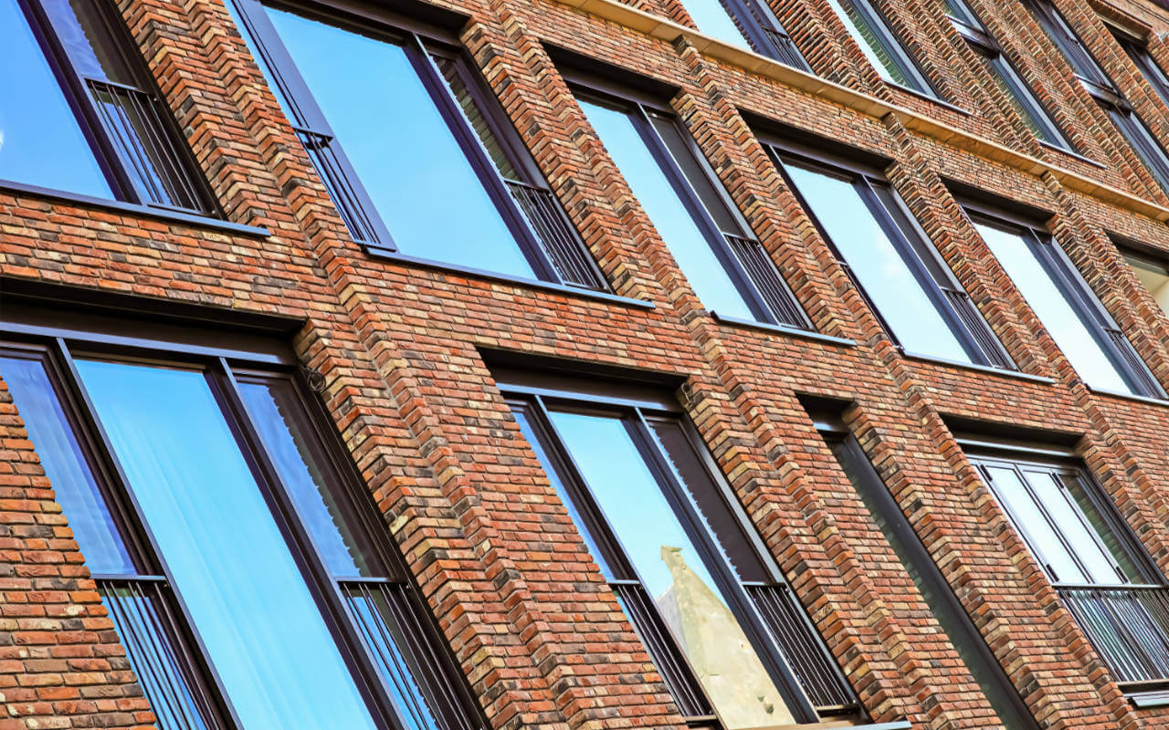 Social housing Brick apartments windows close-up